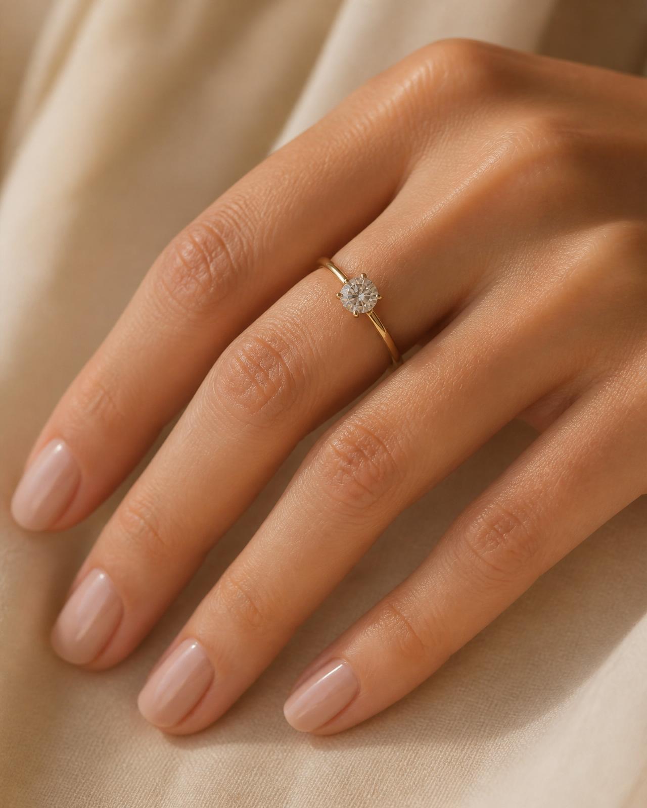 Luxury jewelry — hands wearing fine gold and diamond rings